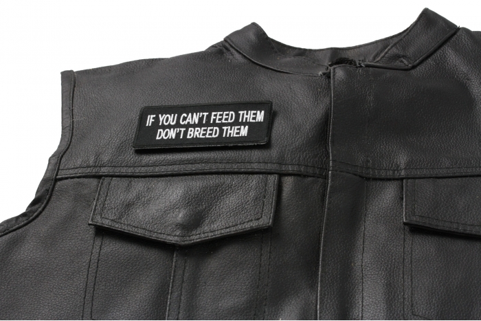 If You Can't Feed Them Don't Breed Them Patch - 4x1.75 inch. Embroidered Iron on Patch shown on leather vest