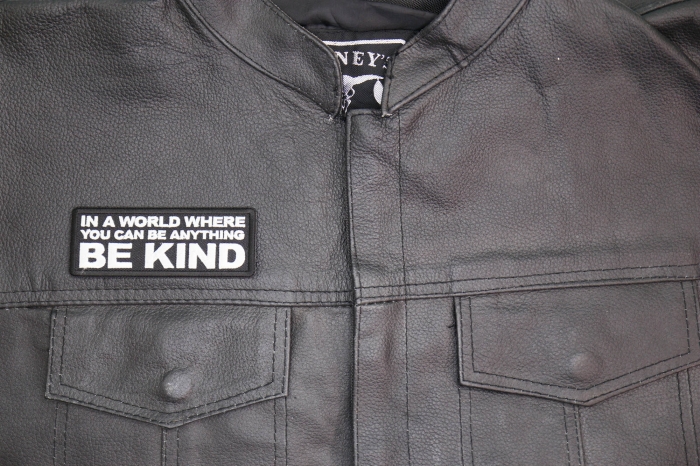 In a World Where you can be Anything Be Kind Patch shown on leather vest