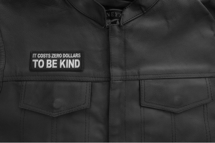 It costs zero dollars to be kind patch shown on leather vest
