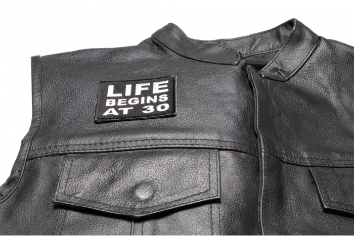 Life Begins at 30 Patch - 3x2 inch. Embroidered Iron on Patch shown on leather vest