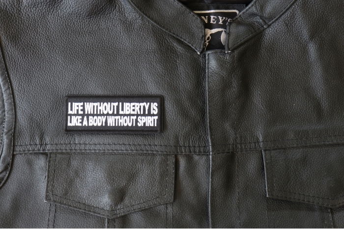 Life Without Liberty is Like a Body Without Spirit Patch - 4x1.5 inch - Embroidered Iron on Patch shown on leather vest
