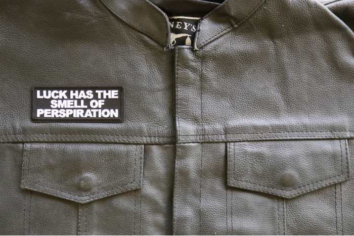 Luck has the Smell of Perspiration Patch, Funny Saying Patches, Sew or Iron on Patch shown on leather vest