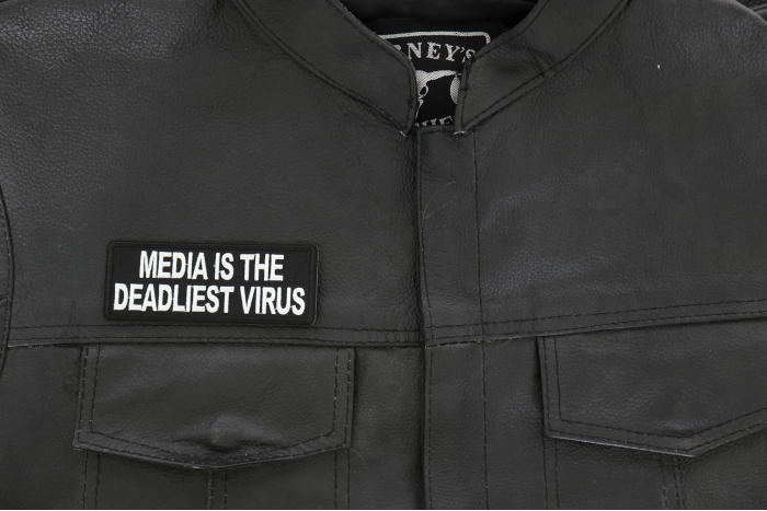 Media is the Deadliest Virus Patch - 4x1.5 inch - Embroidered Iron on Patch shown on leather vest
