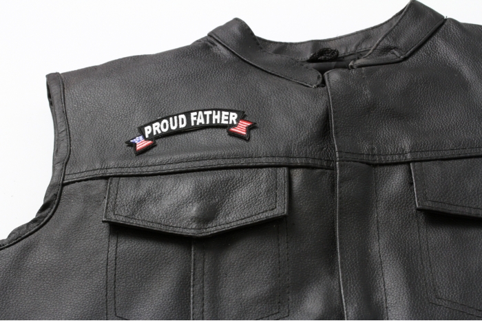 Proud Father US Flag Rocker Patch - 4x1.5 inch. Embroidered Iron on Patch shown on leather vest