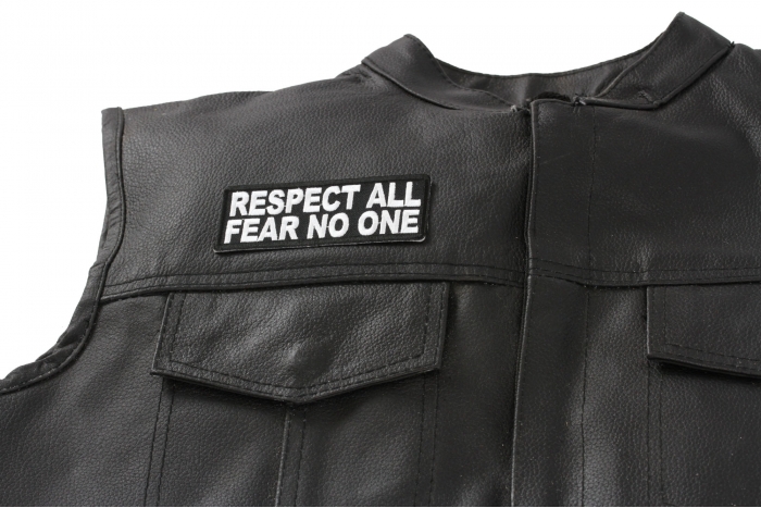 Respect All Fear No One Patch - 4x1.5 inch. Embroidered Iron on Patch shown on leather vest