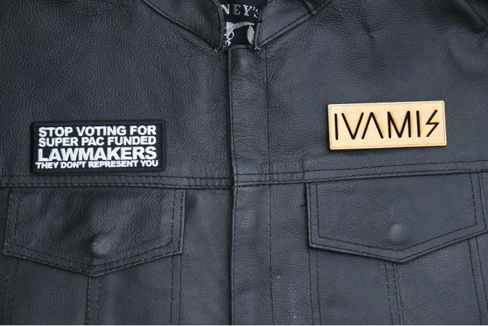Stop Voting For Super Pac Funded Lawmakers They Don't Represent You Patch shown on leather vest