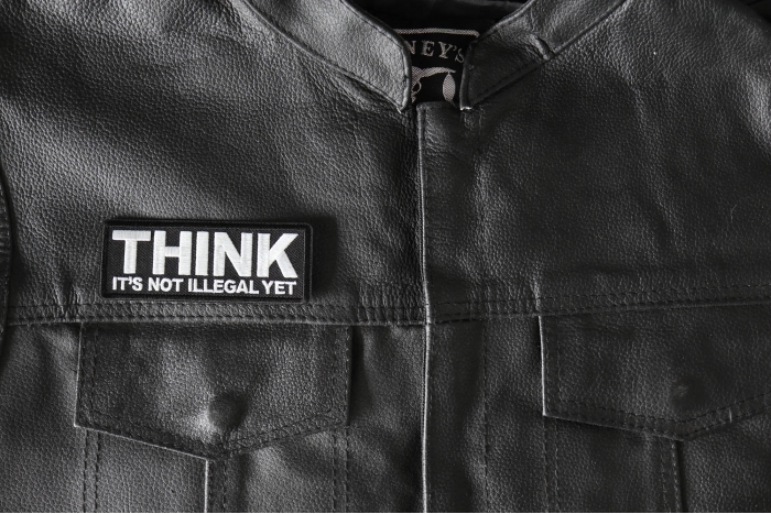 Think it's Not illegal Yet Patch - 4x1.5 inch - Embroidered Iron on Patch shown on leather vest