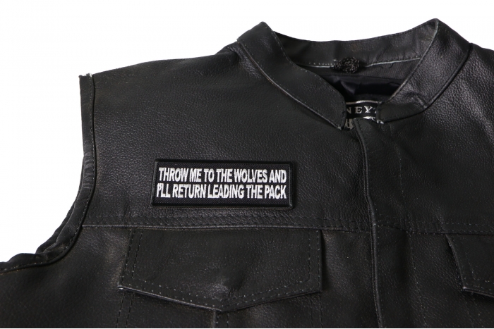 Throw Me to The Wolves and I'll Return Leading The Pack Patch - 4x1.5 inch. Embroidered Iron on Patch shown on leather vest