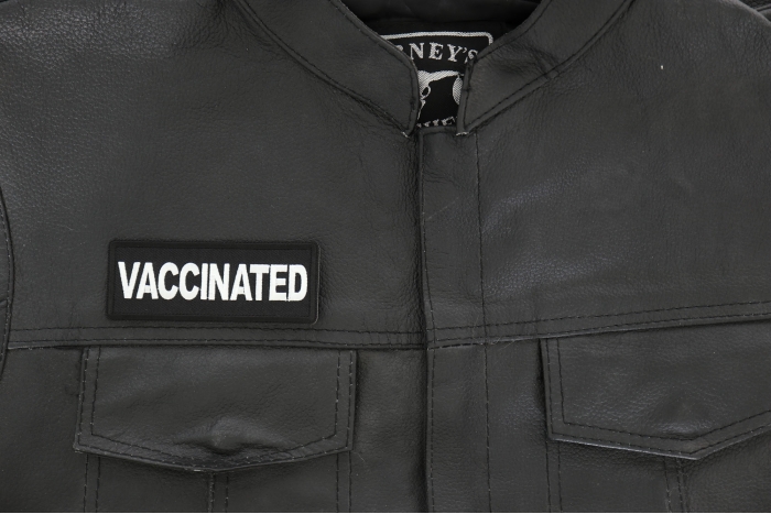 Vaccinated Patch - 4x1.5 inch - Embroidered Iron on Patch shown on leather vest
