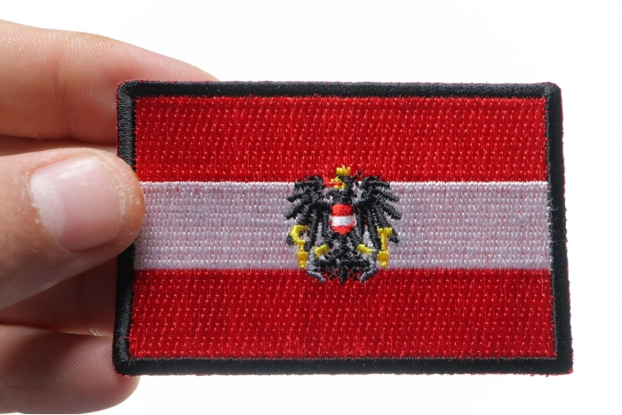 Austrian Flag Patch shown on hand for size comparison