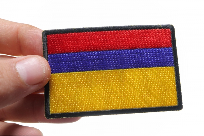 Colombia Flag Patch shown on hand for size comparison