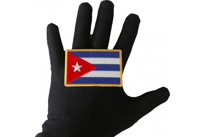 Cuba Flag Patch shown on hand for size comparison
