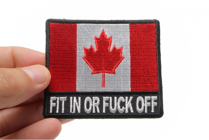 Fit In or Fuck Off Canada Flag Patch shown on hand for size comparison