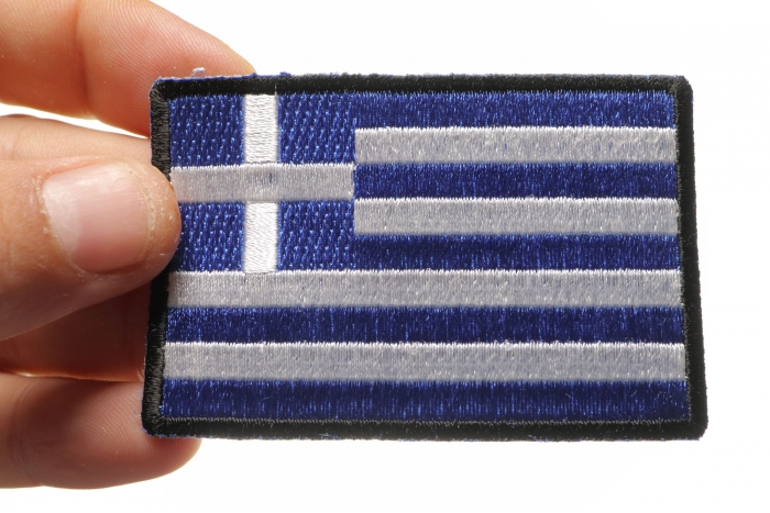 Greek Flag Patch shown on hand for size comparison