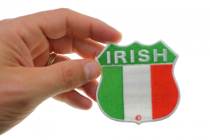 Irish Shield Flag Patch shown on hand for size comparison