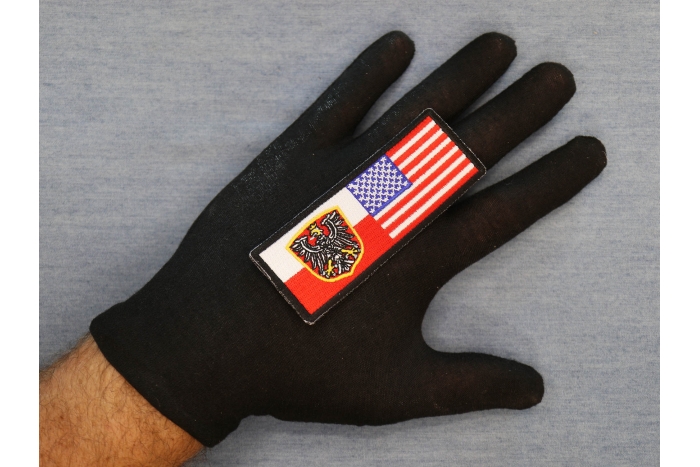 Polish American Flag shown on hand for size comparison