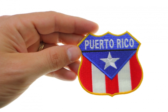 Puerto Rico Shield Flag Patch shown on hand for size comparison