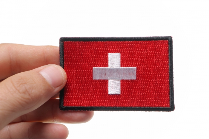 Swiss Flag Patch shown on hand for size comparison