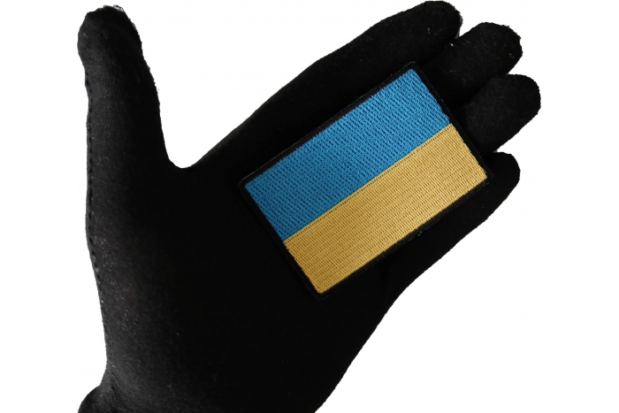 Ukraine Flag Patch shown on hand for size comparison
