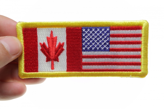 USA Canada Patch shown on hand for size comparison