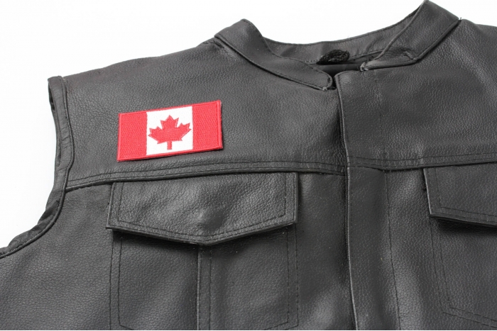 Canada Flag Patch Small - 3x2 inch. Embroidered Iron on Patch shown on leather vest