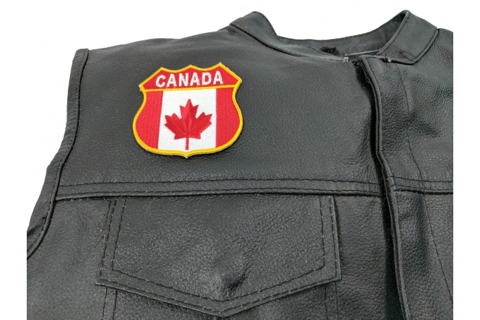 Canadian Shield Patch - Canada Flag - 2.75x2.75 inch. Embroidered Iron on Patch shown on leather vest