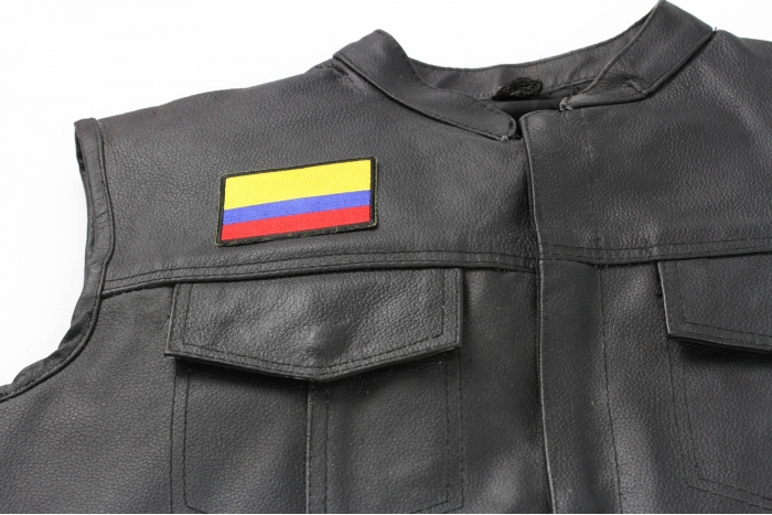 Colombia Flag Patch - 3x2 inch. Embroidered Iron on Patch shown on leather vest
