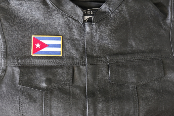 Cuba Flag Patch - 3x2 inch - Embroidered Iron on Patch shown on leather vest
