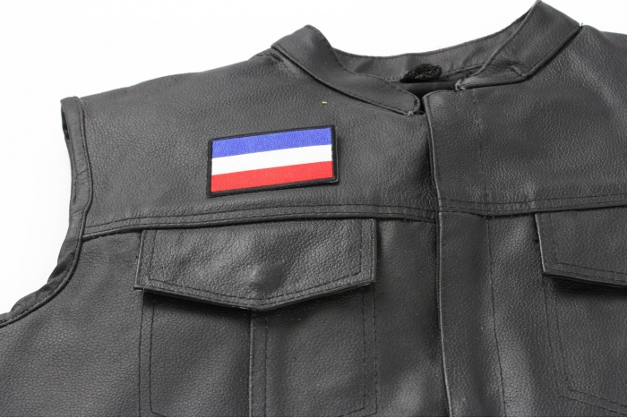 Dutch Flag Patch - 3x2 inch. Embroidered Iron on Patch shown on leather vest