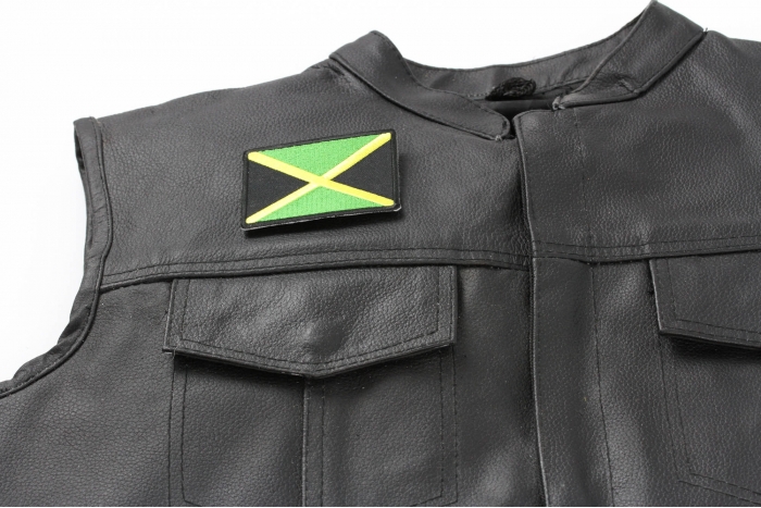 Jamaican Flag Small Patch - 3x2.5 inch. Embroidered Iron on Patch shown on leather vest