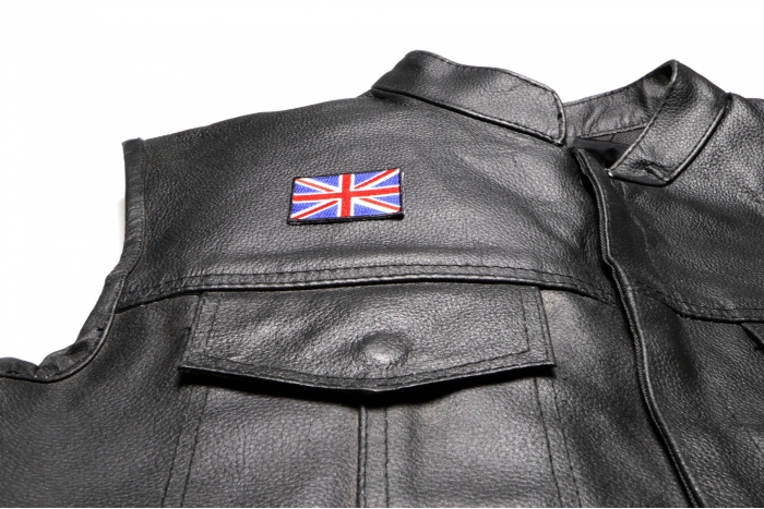 Small Great Britain Flag Patch - 2x1.25 inch. Embroidered Iron on Patch shown on leather vest