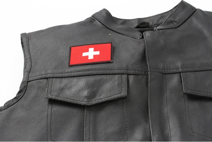Swiss Flag Patch - 3x2 inch. Embroidered Iron on Patch shown on leather vest