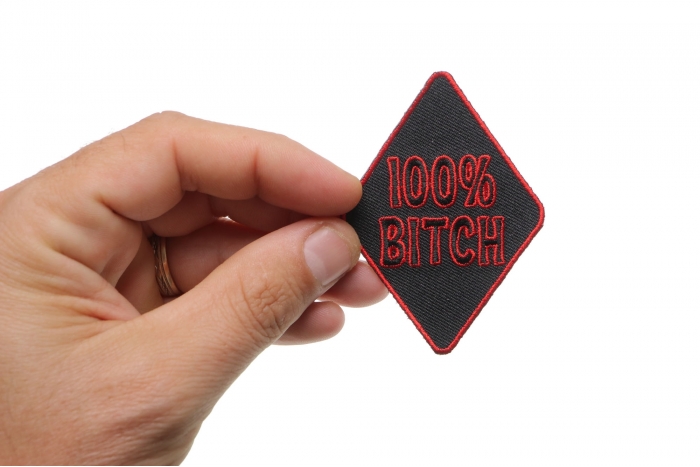 100 Percent Bitch Patch shown on hand for size comparison