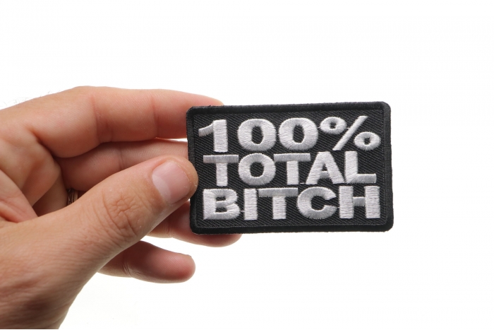 100 Percent Total Bitch Patch, Funny Patches for Adults shown on hand for size comparison