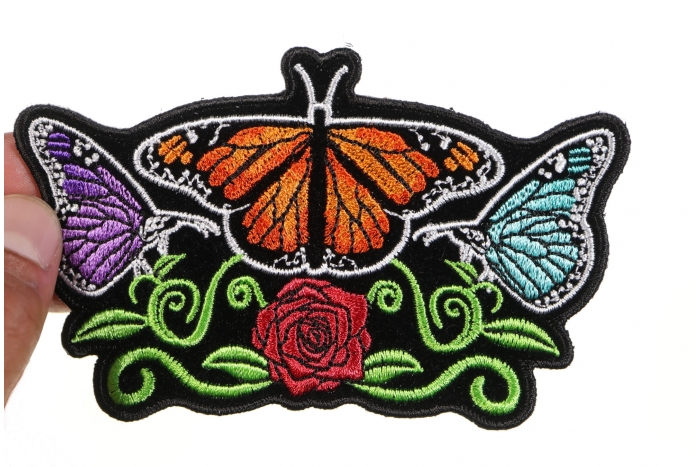 Butterflies and Flower Ladies Patch shown on hand for size comparison