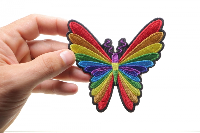 Colorful Butterfly Patch shown on hand for size comparison