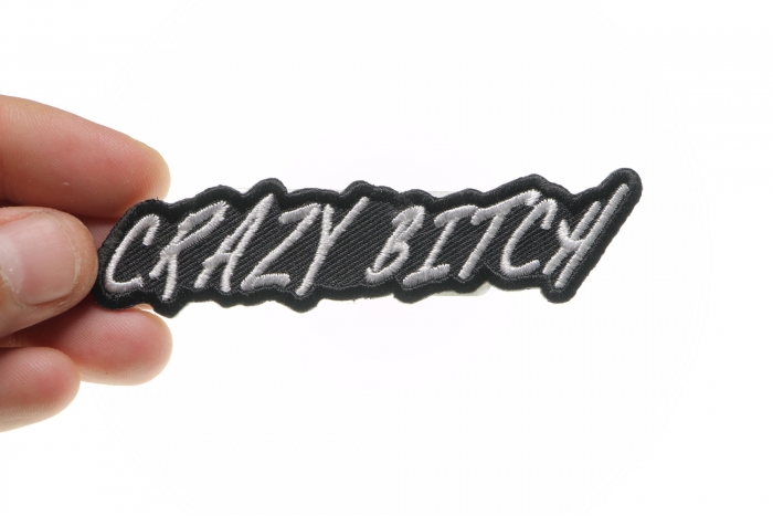 Crazy Bitch Patch shown on hand for size comparison
