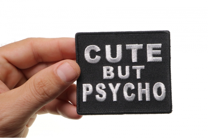 Cute But Psycho Patch shown on hand for size comparison