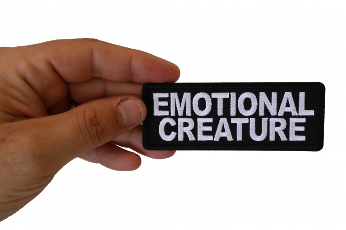 Emotional Creature Patch shown on hand for size comparison