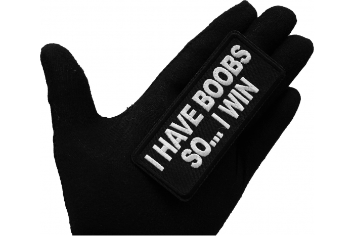 I have Boobs So I Win Iron on Patch shown on hand for size comparison