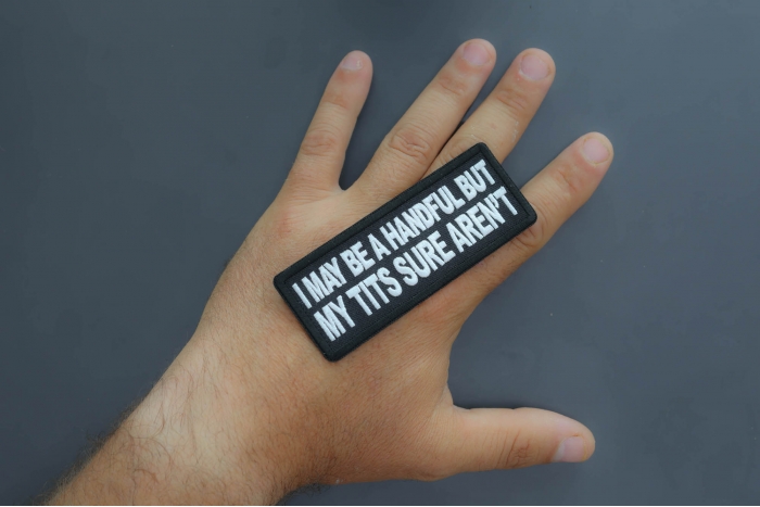 I may be handful but my tits sure aren't patch shown on hand for size comparison