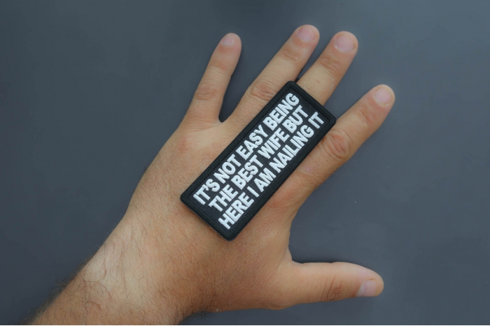 It's not easy being the best wife but here I am nailing it patch shown on hand for size comparison