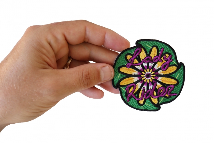 Lady Rider Flowers Iron on Patch shown on hand for size comparison