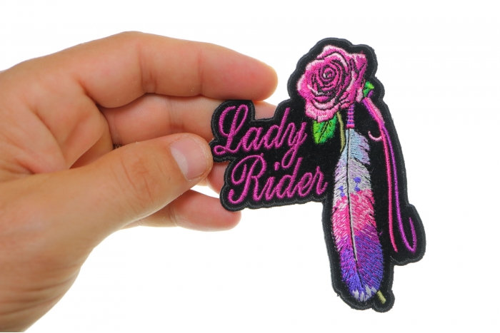 Lady Rider With Purple Rose and Feather Vertical Small Patch shown on hand for size comparison