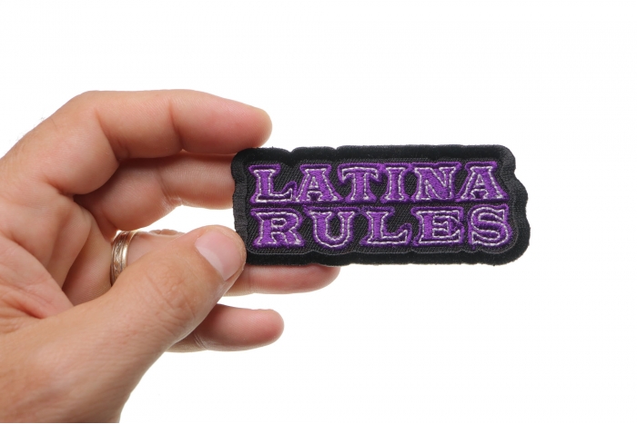 Latina Rules Funny Iron on Patch shown on hand for size comparison