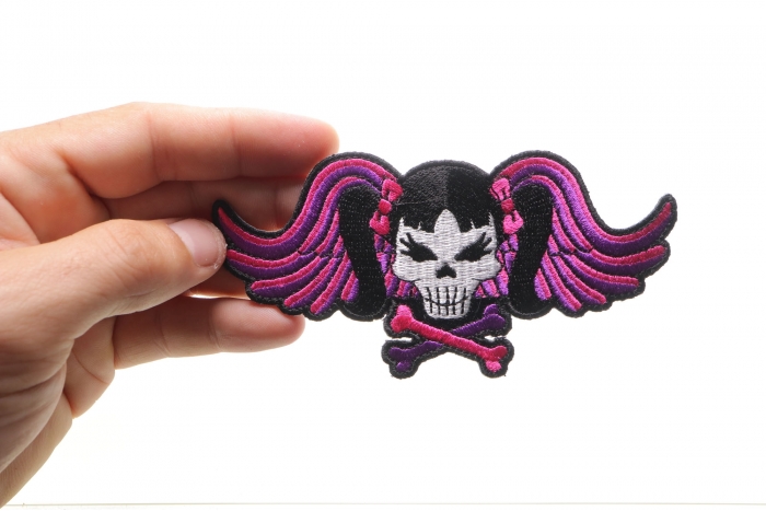 Pigtails Skull and Wings Patch, Biker Skull Patches shown on hand for size comparison