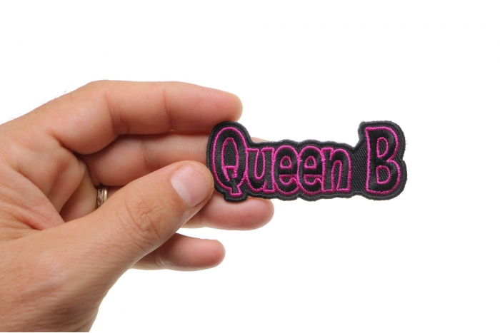 Queen B Patch shown on hand for size comparison