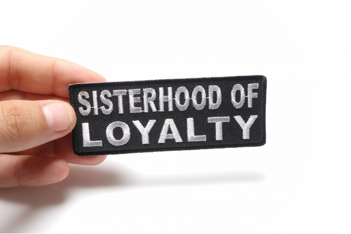 Sisterhood Of Loyalty Patch shown on hand for size comparison