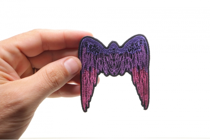 Small Angel Wings Biker Patch Pink shown on hand for size comparison