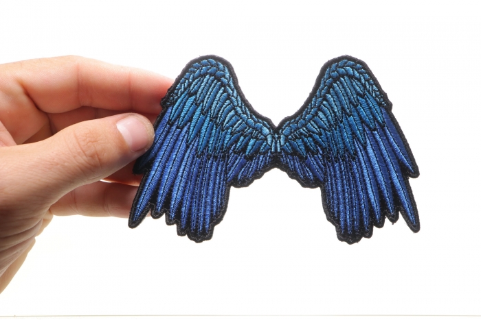 Small Beautiful Angel Wings Blue Patch shown on hand for size comparison